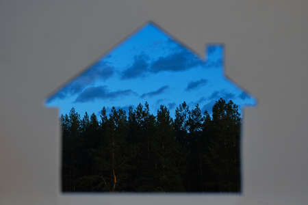 Silhouette of a house against the evening sky and forest.Travel and outdoor recreation, In the open,