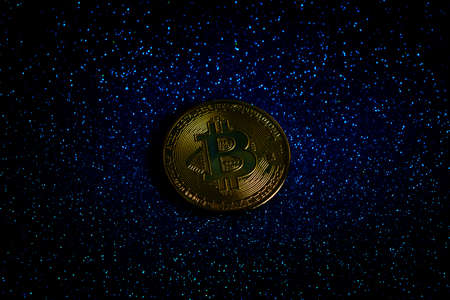 Bitcoin cryptocurrency coin on the background of the starry skyの写真素材
