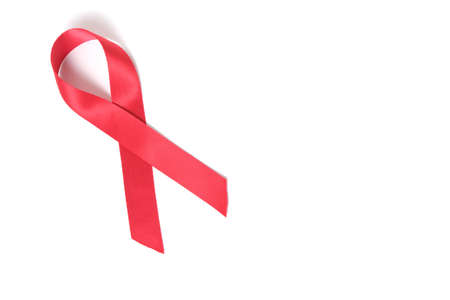 Red ribbon on white background is symbol of disease AIDS and drug abuseの写真素材
