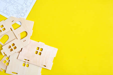 Details and instructions, constructor of prefabricated wooden orphanage on yellow background