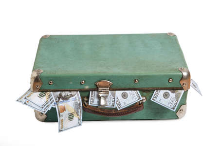 Old, green, retro vintage suitcase filled with money.On a white background, isolateの写真素材