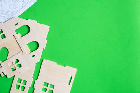 Details and instructions, constructor of prefabricated wooden orphanage on green backgroundの写真素材