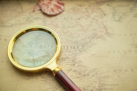 Territory of United States of America on old retro map and magnifying glass