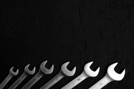 Set of wrenches on a black backgroundの写真素材