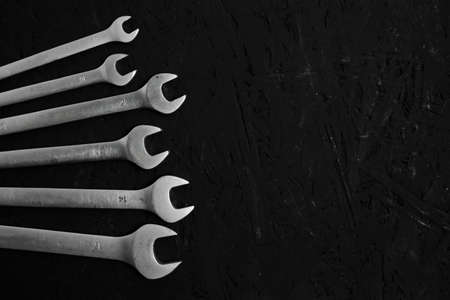 Set of wrenches on a black background