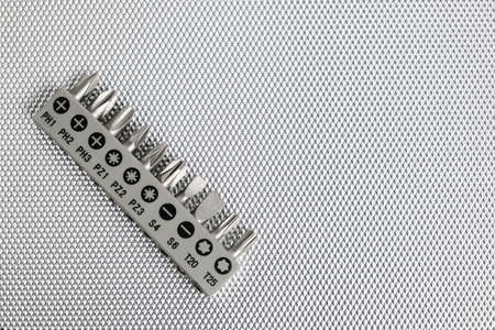 Set of attachments, bits for a screwdriver on a white background
