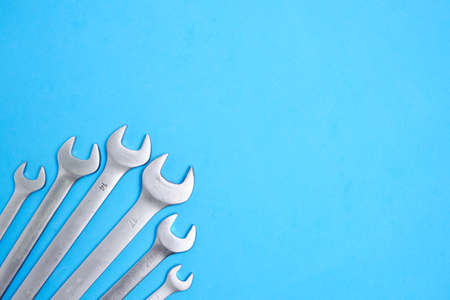 Set of wrenches on a blue backgroundの写真素材