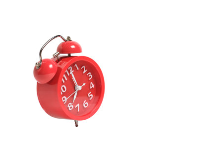 Ringing red alarm clock, isolate on white background, eight morning or eveningの写真素材