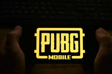 Kostanay, Kazakhstan, November 01, 2021. In the hands of a mobile phone with the logo of the popular mobile game PUBGのeditorial素材