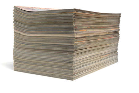 Stack of magazines and newspapers on a white background