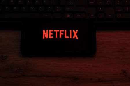 Kostanay, Kazakhstan, November 16, 2021.NETFLIX logo is an American entertainment company, a streaming service for movies and TV series on smartphone screenのeditorial素材