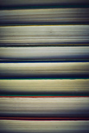 Background, stack of old books with yellowed pages.の写真素材