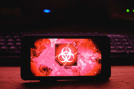 Kostanay, Kazakhstan, November 01, 2021. In hand is mobile phone with a screensaver of popular game Plague Incのeditorial素材