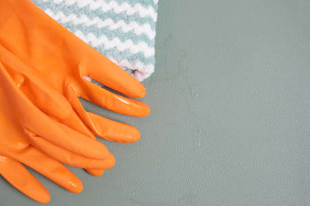Wet cleaning gloves and a rag.Concept of cleaning rooms and bathrooms