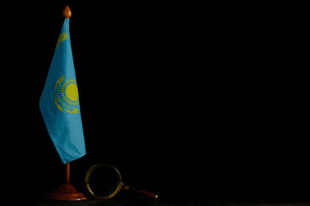 Flag Kazakhstan and magnifying glass on black background.Concept, under close attentionの写真素材