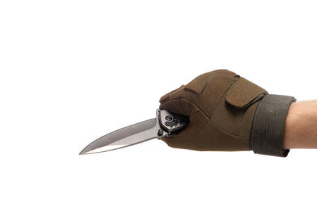 Hand in tactical glove, holding folding knife, on white backgroundの写真素材