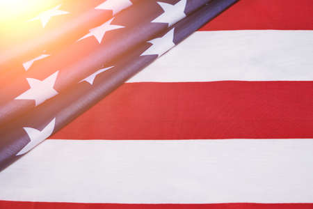 Flag United States of America in bright rays sun.Star spangled flag is symbol of democracy and freedomの写真素材