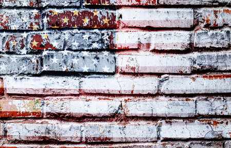Worn and weathered image flag United States of America on an old brick wallの写真素材