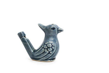 Porcelain whistle form bird, children toy on white backgroundの写真素材