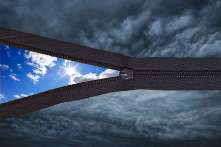 Concept black thunder clouds with zipper and sunny summer blue sky with clouds on the...