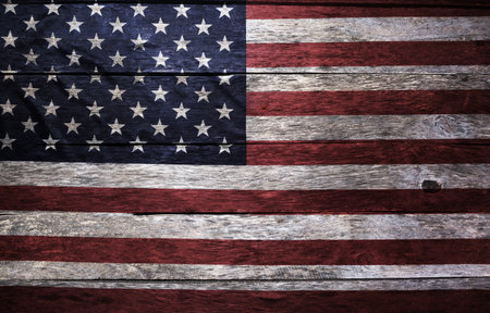 Worn and weathered image flag United States America on an old board wall