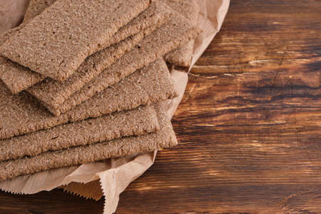 Rye bread on wooden background.Popular product is delicious and healthy food for weight lossの写真素材