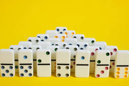 Dominoes on a yellow background, a board gameの写真素材