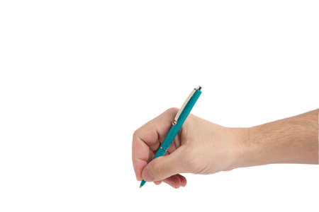 Hand with green ballpoint pen while writing white background