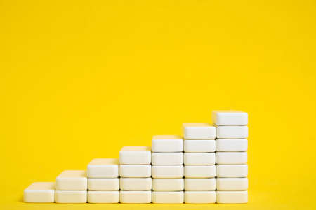 Stairs growing up, growth and rise graph yellow background
