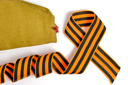 Cap with red star and George ribbon, headdress serviceman Red Army Soviet Union, on white backgroundの写真素材