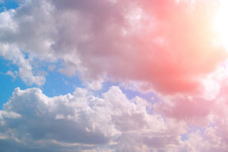 Bright pink, summer clouds against the blue sky