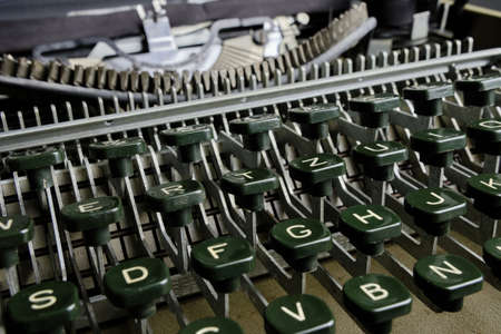 Old retro typewriter with mechanical keyboard with alphabet
