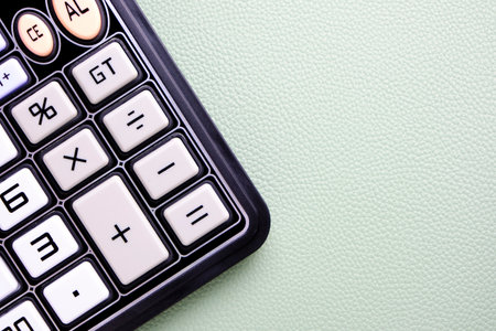 Calculator on table with skin texture background.