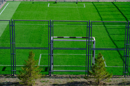 Football field with gate and freshly laid green lawnの写真素材