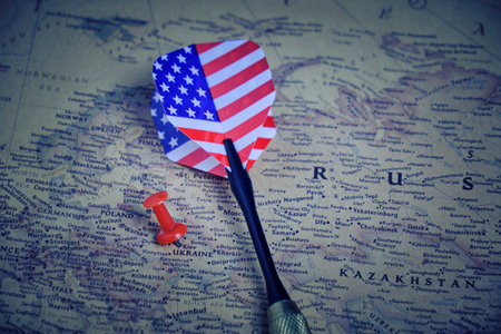 Dart for playing darts with color of flag United States America lies map territory of Ukraine and...
