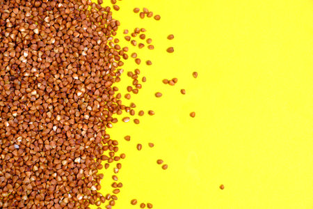 Buckwheat on yellow background.Healthy foodの写真素材