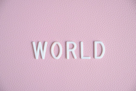 Word world in white letters pink backgroundの写真素材