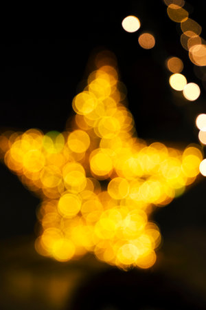 Blurred bokeh background form of yellow starの写真素材
