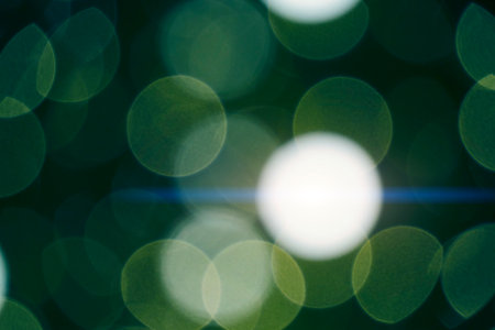 Abstract bokeh background burning light bulbs evening city and garlandsの写真素材