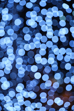 Abstract bright background, bokeh of burning blue light bulbsの写真素材