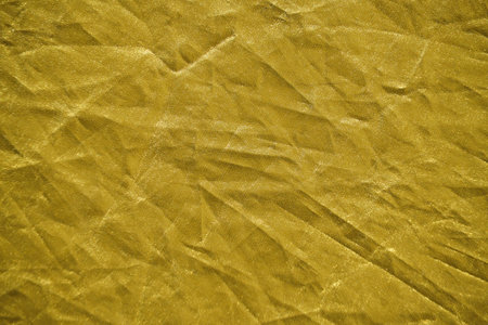 Abstract yellow gold background crumpled fabricの写真素材