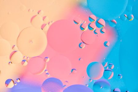 Bright abstract, multicolored background with oil circles.With blue, lilac, pink and beige color