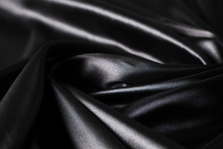 Background black twisted silk fabric,abstract texture satin fabricの写真素材