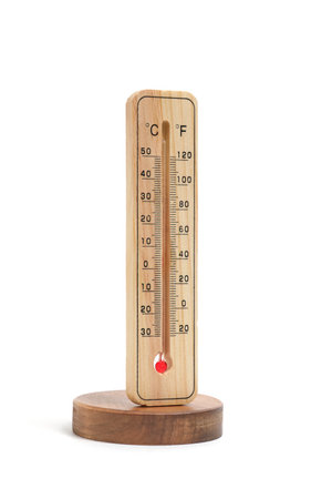Wooden outdoor thermometer is mounted wooden stand white background