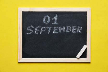 Blackboard with inscription is written in chalk on September 01の写真素材