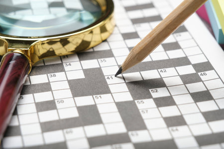 Crossword, magnifying glass and pencil. Set for training mindの写真素材