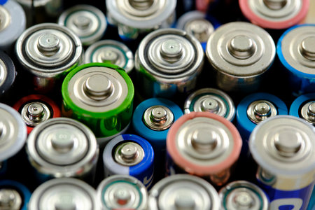 Background consists variety diverse and colorful, used batteriesの写真素材