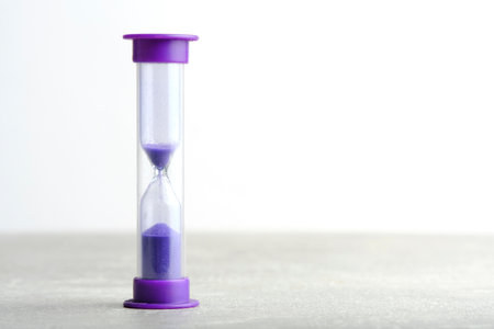 Hourglass for one minute purple on light backgroundの写真素材