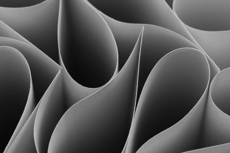 Abstract, grey paper background with smooth lines
