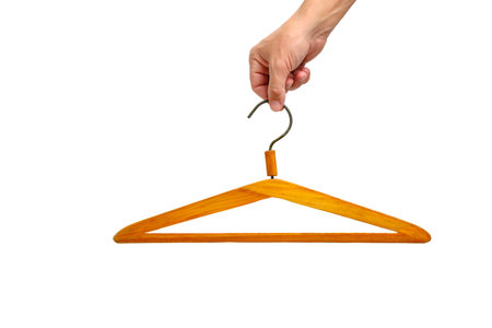 Hand white background holds wooden hangerの写真素材